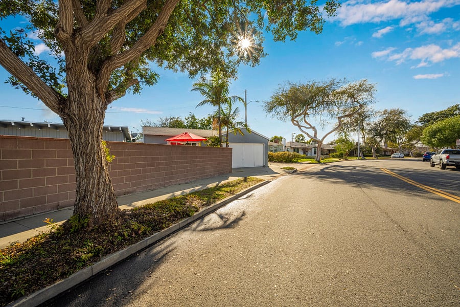 Treelined street. Guesthouse is attached to garage.