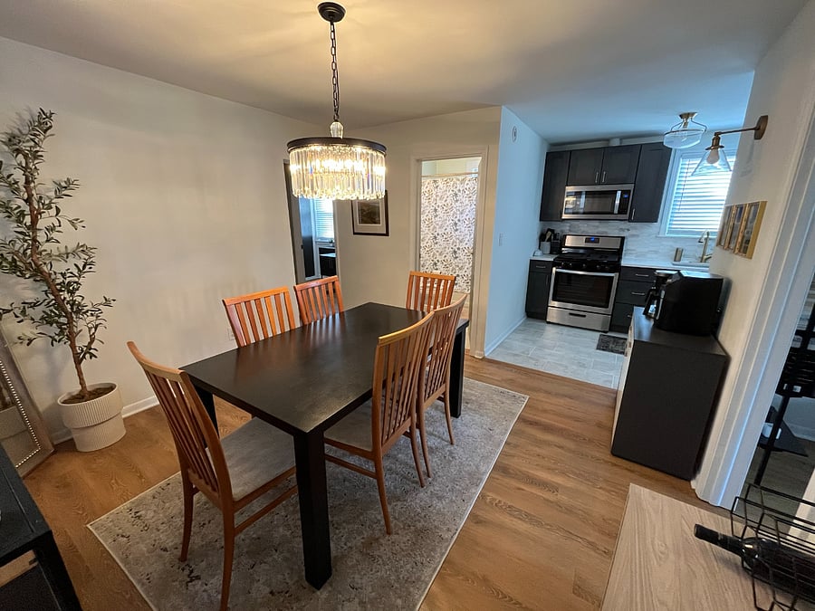 alternative view of the living room, facing the kitchen, bathroom and office.