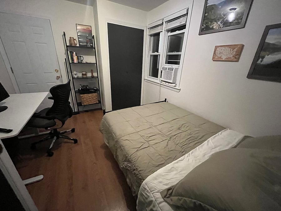 Bedroom 2 (full bed), from the hallway, facing the back door.