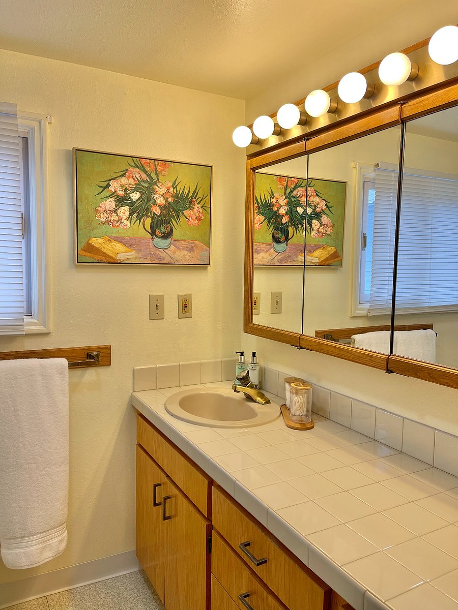 Bath with shower, stacked washer/dryer. Plenty of counter space.