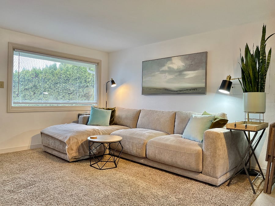 Living with large comfy sectional. Plenty of room for yoga.