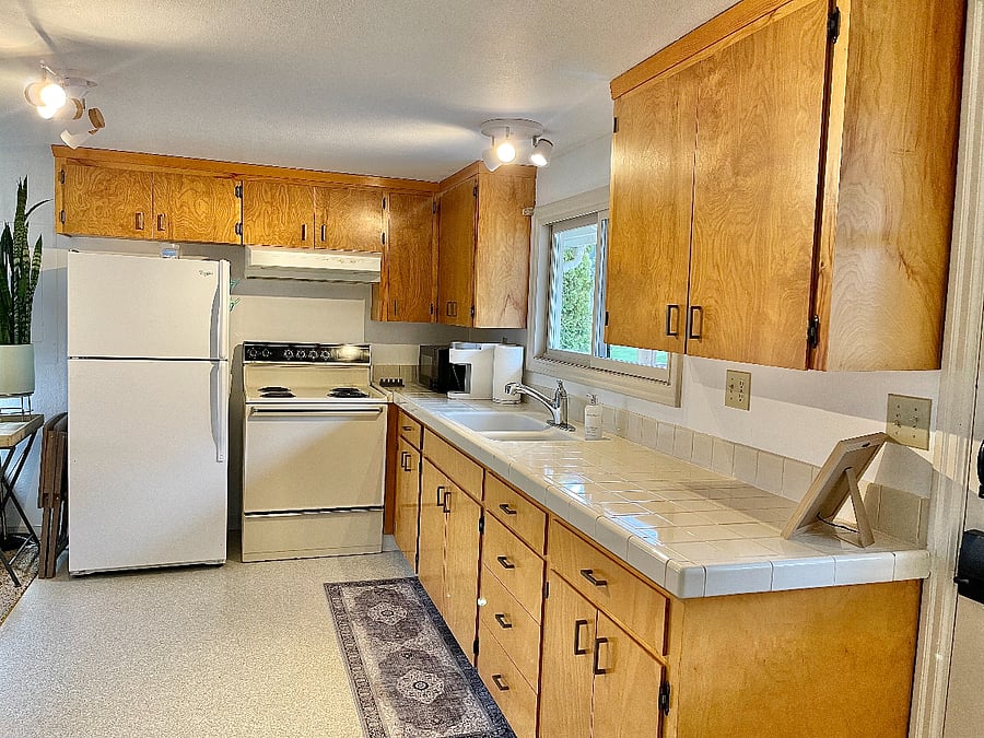Open concept kitchen adjacent living area.