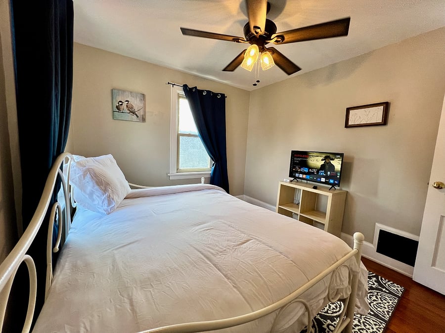 Private Bedroom Suite 3 with full size bed, smart tv, and lots of windows!