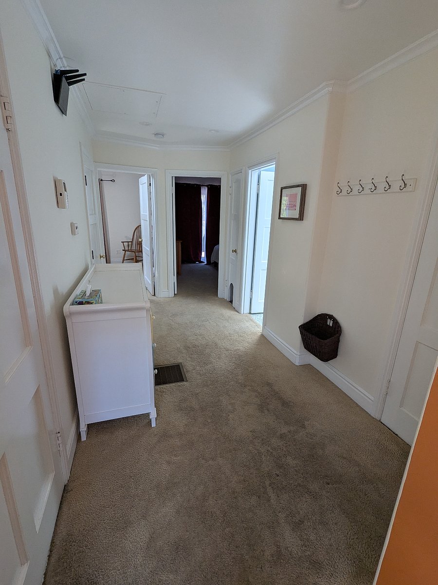 hallway looking from living room towards bedrooms and bathroomskylight