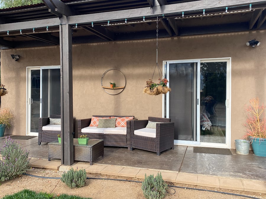 Front patio has drop down sun shades for privacy.