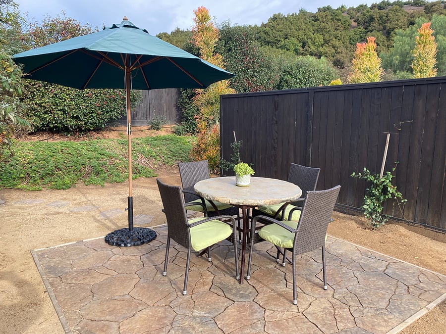 Side patio perfect spot for morning coffee or afternoon BBQ.
