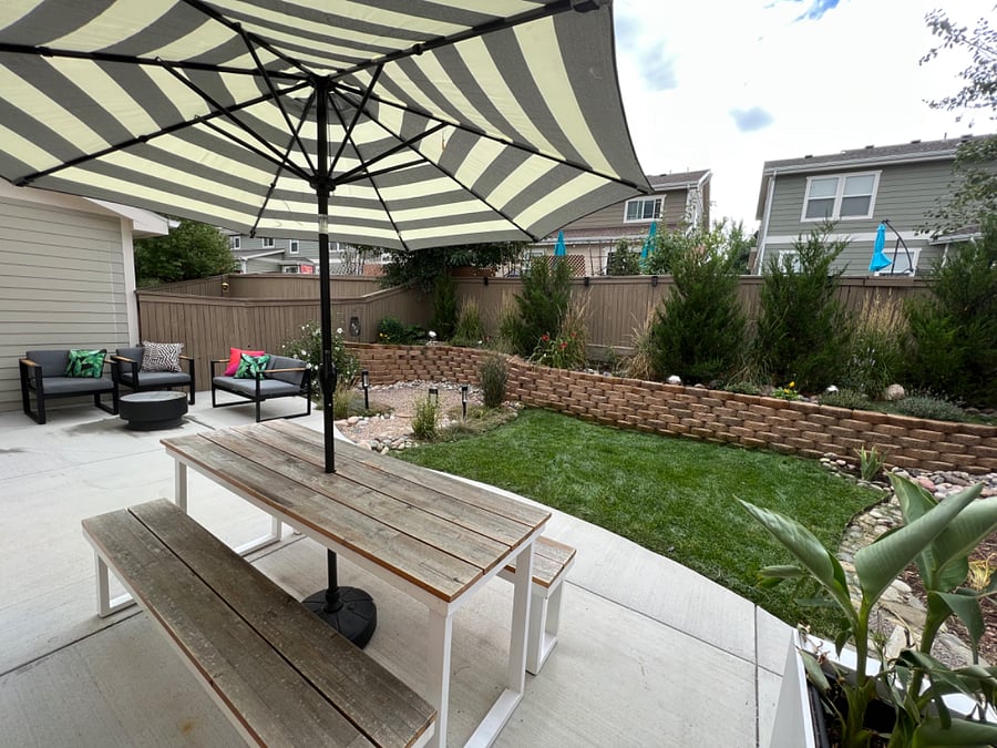 Quiet shared backyard with sitting and eating areas