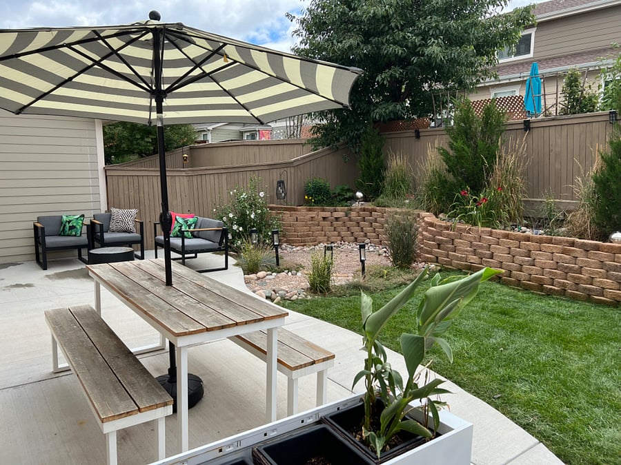 Quiet shared backyard with sitting and eating areas