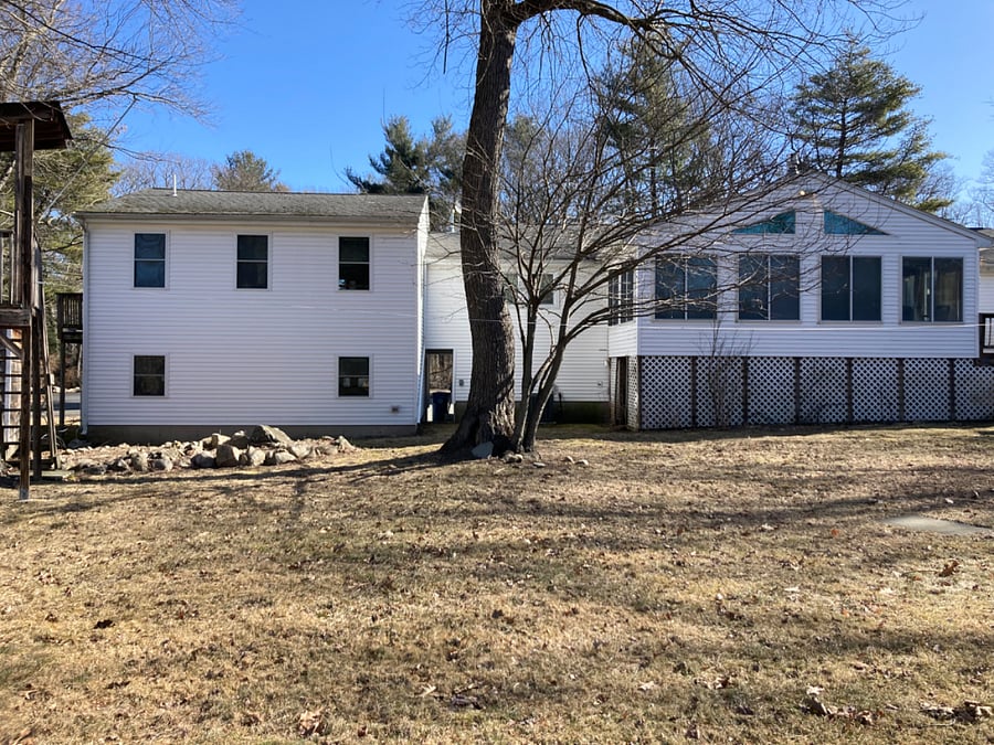 View from the back yard. Your space is on the left. In warm months, there will be lawn furniture that you may enjoy, and multiple flower beds!