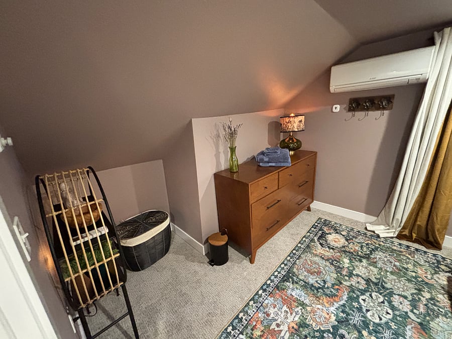 The entry of your bedroom. Entry shelf, hamper, laundry basket, dresser, AC/Heat mini split. 