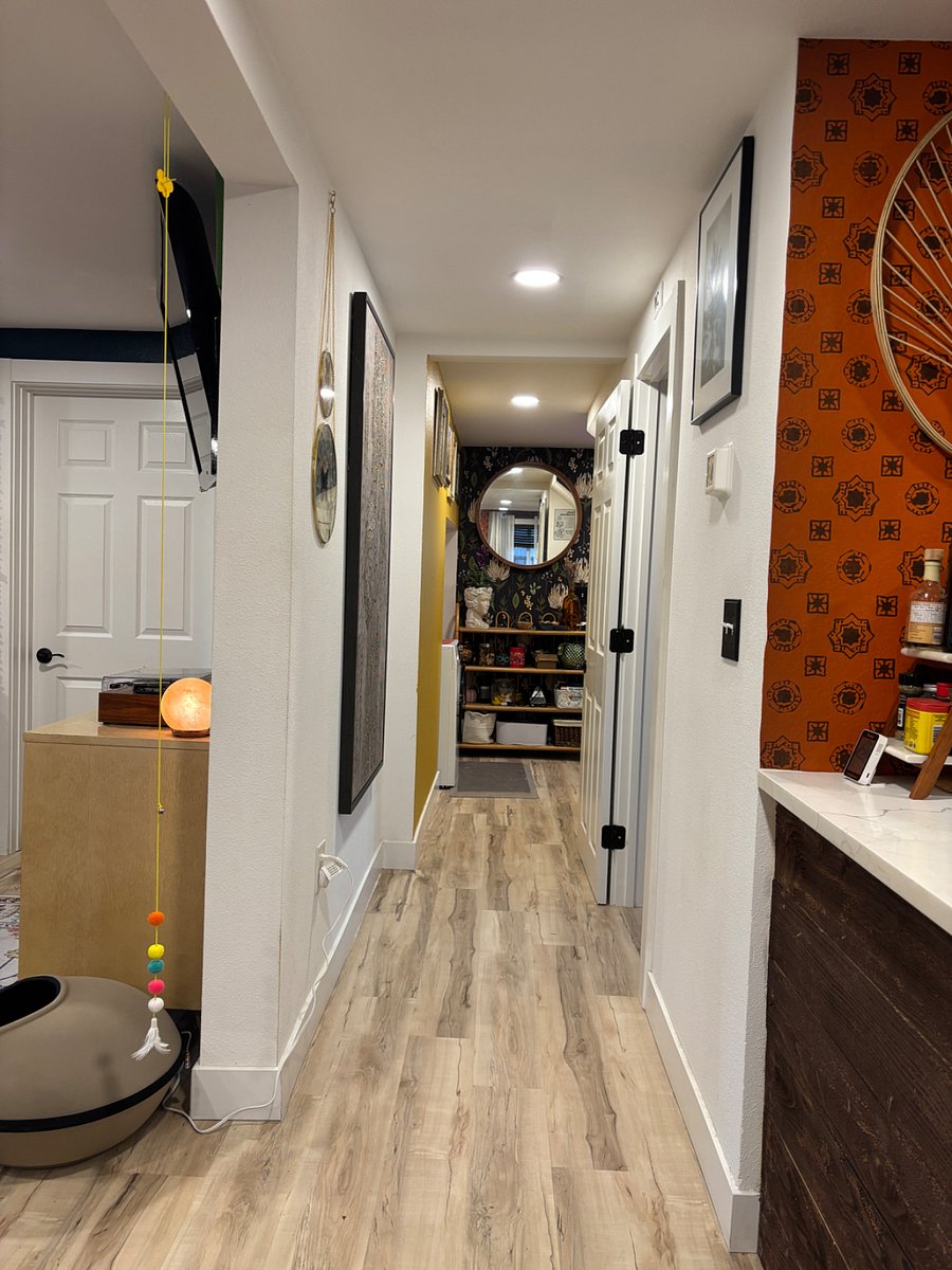 Downstairs hallway. The kitchen and bathroom are on the left. 