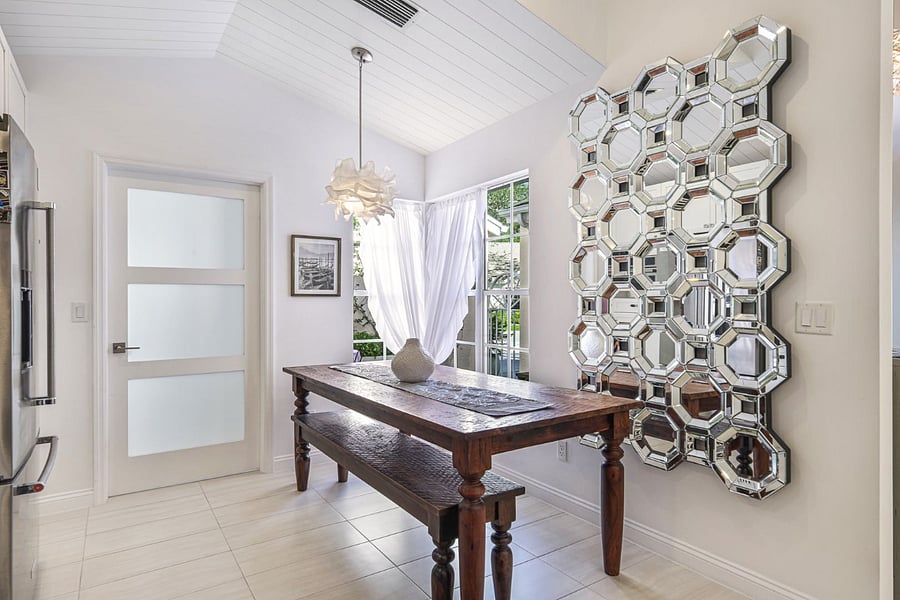 A dining area that receives morning sun and looks out onto the private courtyard.