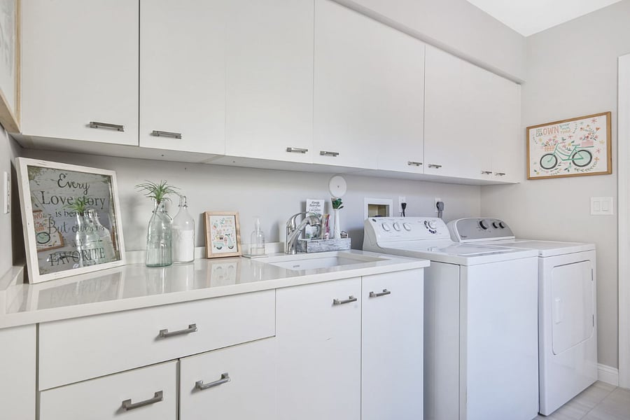 The best room in the house for taking care of all of our " stuff" . This laundry room is fully stocked with various types of detergents, a full size ironing board and cleaning products. 