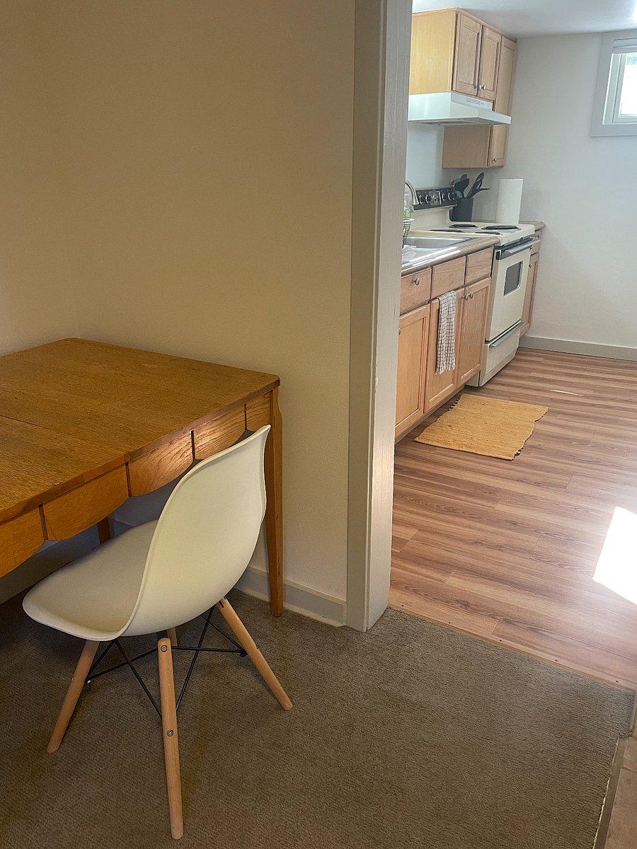 Dining table adjacent to kitchen.