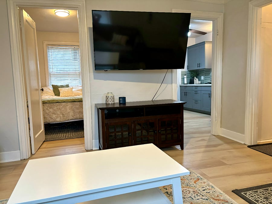 Living room with view to bedroom and kitchen