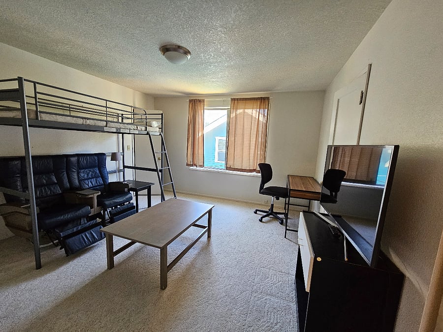 Upstairs bedroom attached to upstairs bath. Features Loft bed to maximize space.