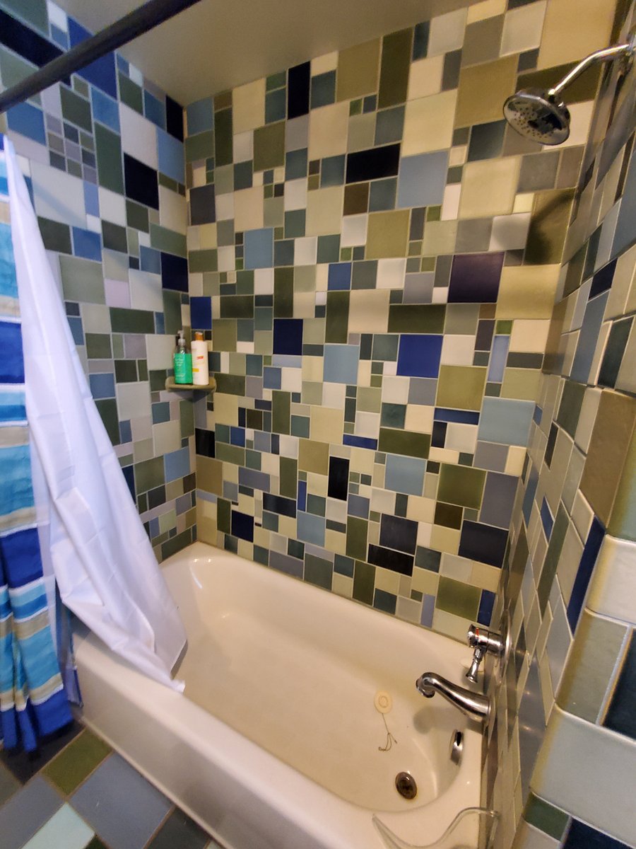 Downstairs bathroom with waterfall style shower. This space is not available currently.