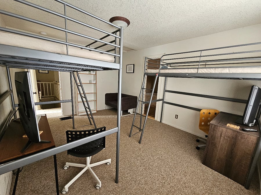 The only double, has loft beds and a large walk in closet to maximize space. 