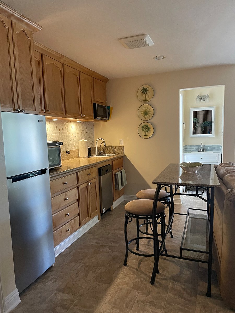 Quartz Dine in kitchen bar, swivel bar stools. Kitchen with filtered drinking water.
Full kitchen with NEW additional appliances.
Keurig coffee maker, crock pot, rice maker, electric griddle, bullet blender. Dishes, pots pans, cooking utensils, eating utensils, storage containers, and more.