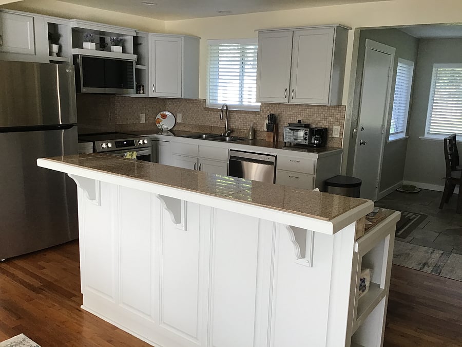 Kitchen with large island bar.
