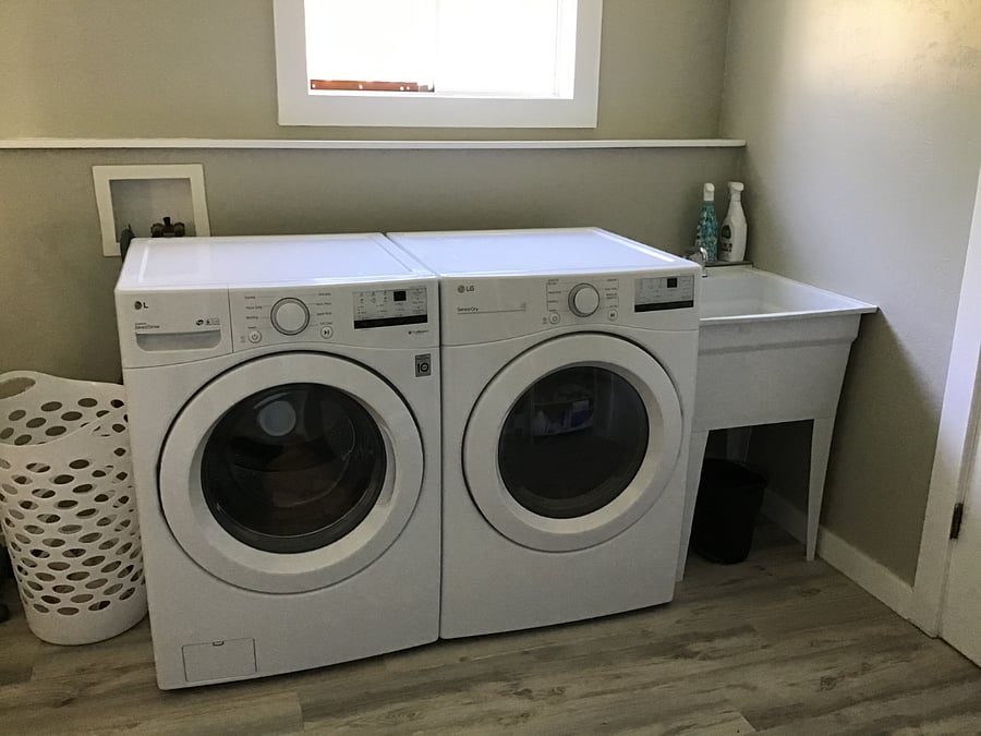 Laundry room available along with sink for bathing your small pup. 