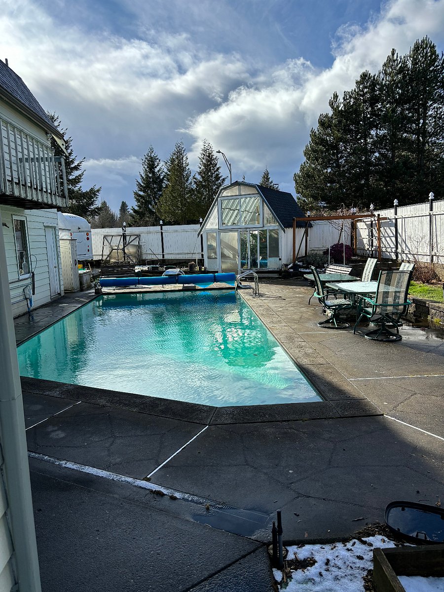 Back yard, 27,000 gallon solar heated pool and greenhouse