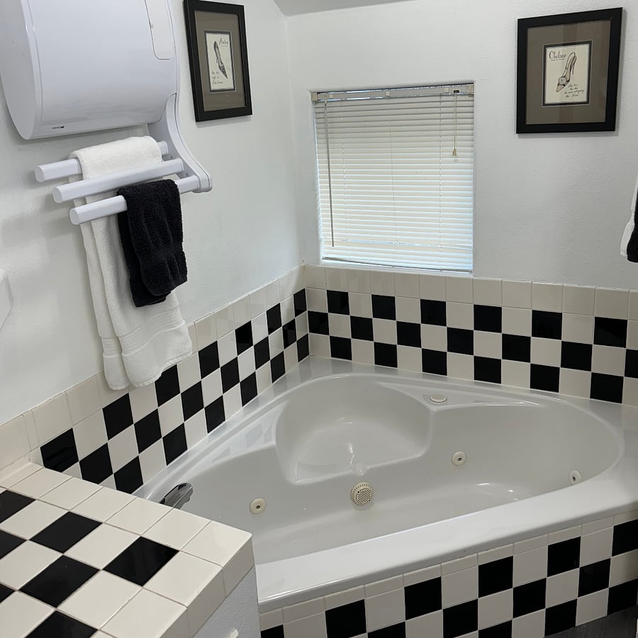 Corner jetted tum with towel heater