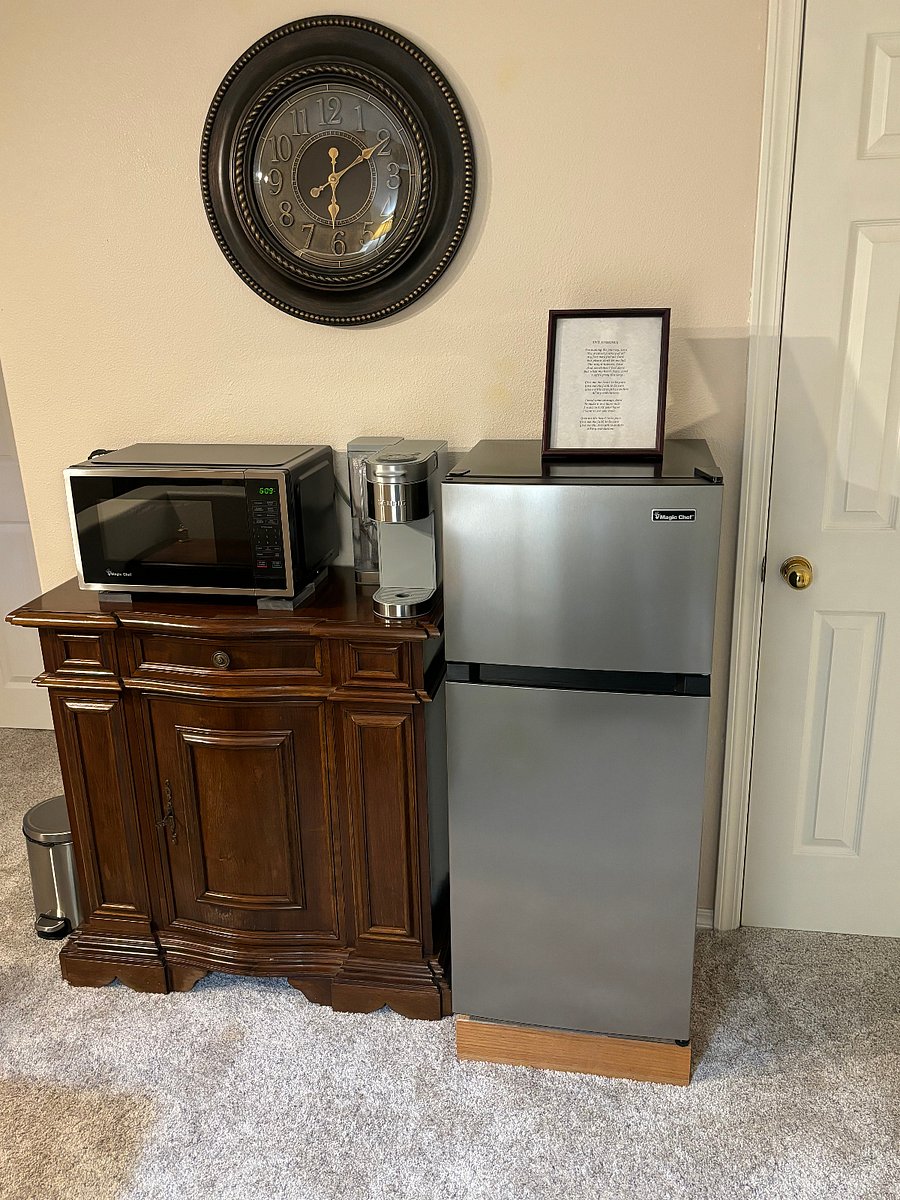 Kitchenette, 4.5 cu ft refrigerator/freezer, Keurig coffee maker, microwave, and fire extinguisher.  
