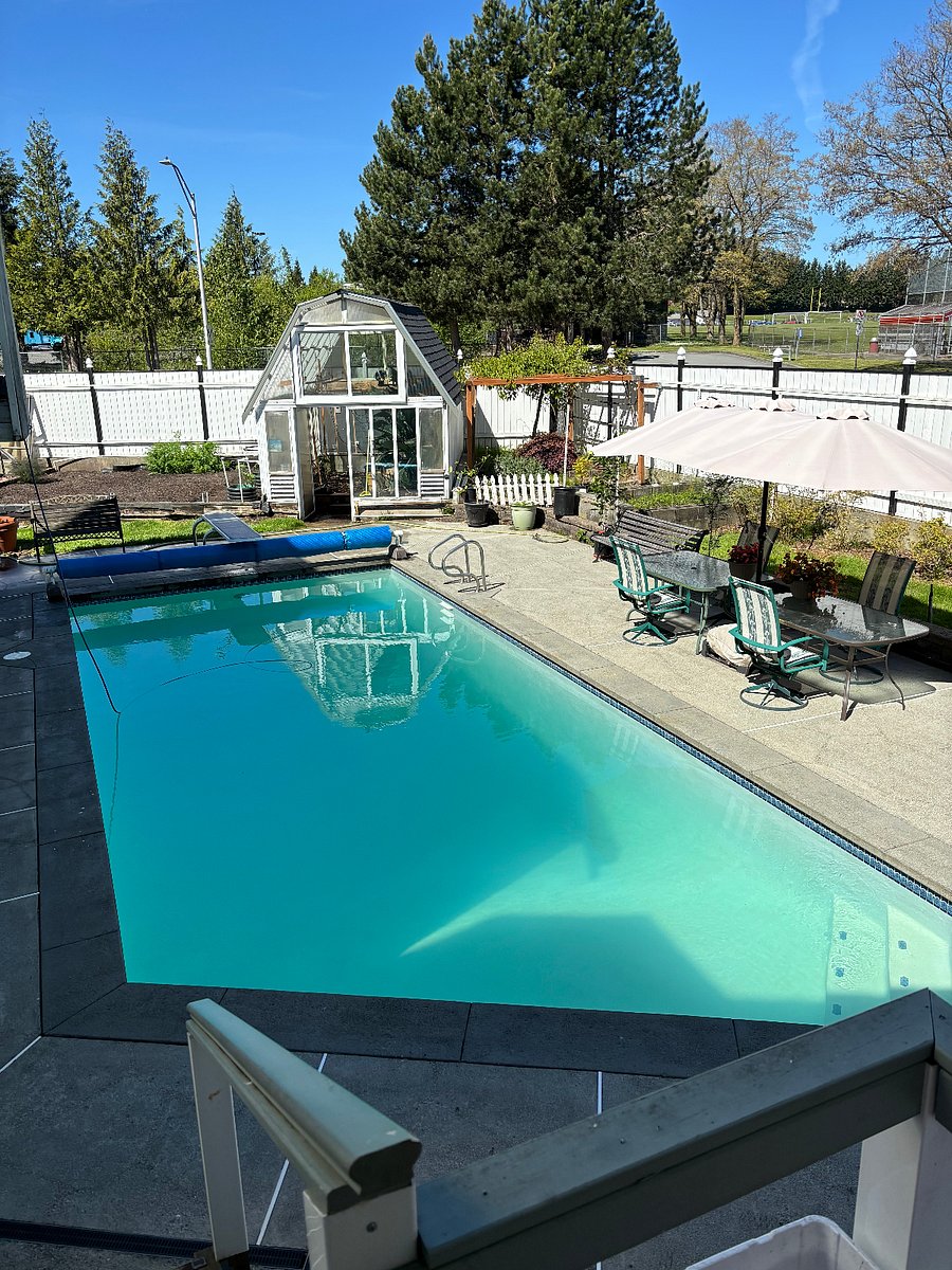 27,000 gallon in-ground diving pool (9" deep). Greenhouse