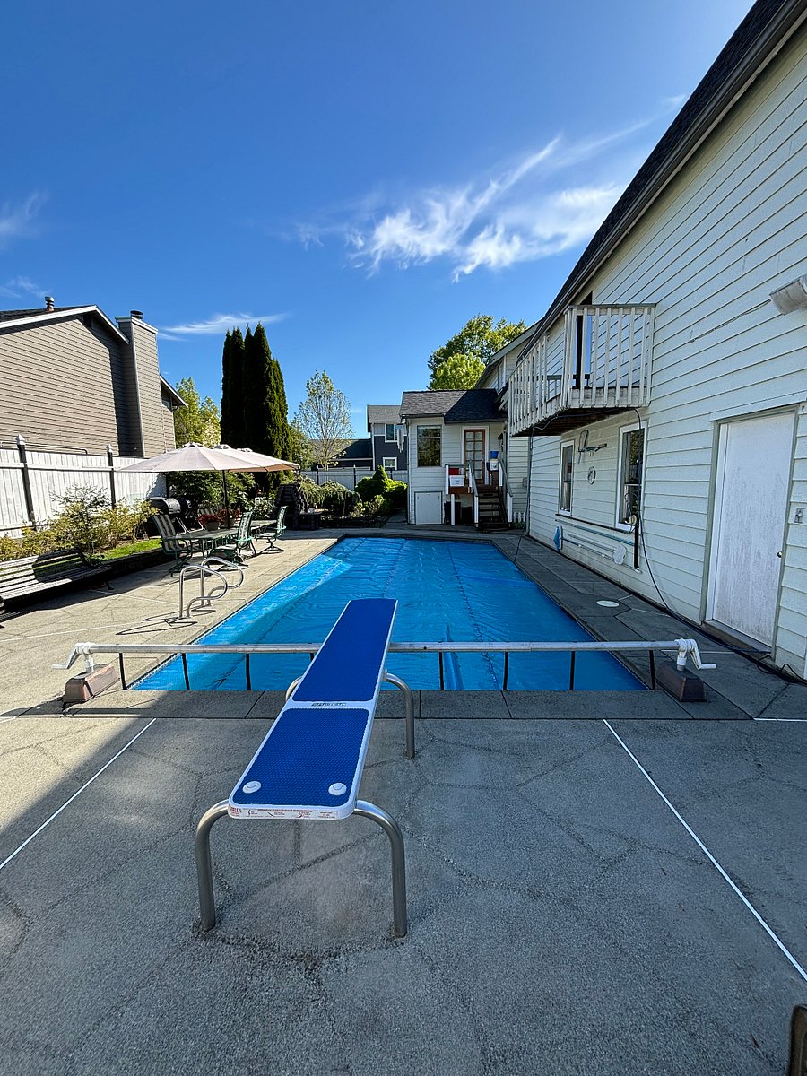 27,000 solar heated diving pool. (9' deep)