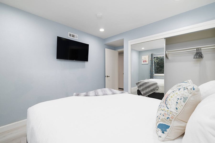 Queen bed & smart TV in bedroom #4