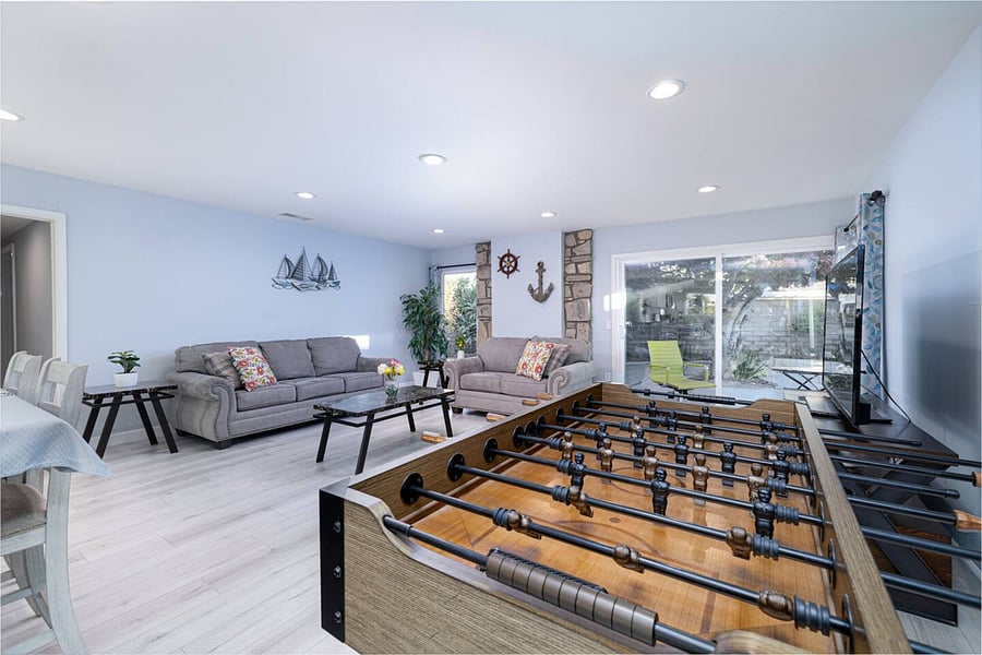 Unwind together with a pool table and foosball, offering the ultimate family game experience.