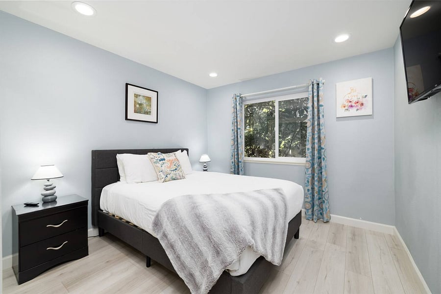Queen bed & smart TV in bedroom #4