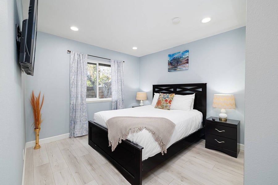 Queen bed & smart TV in bedroom #3