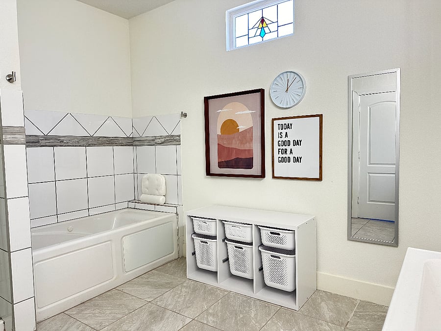 Downstairs shared bathroom with jacuzzi tub.