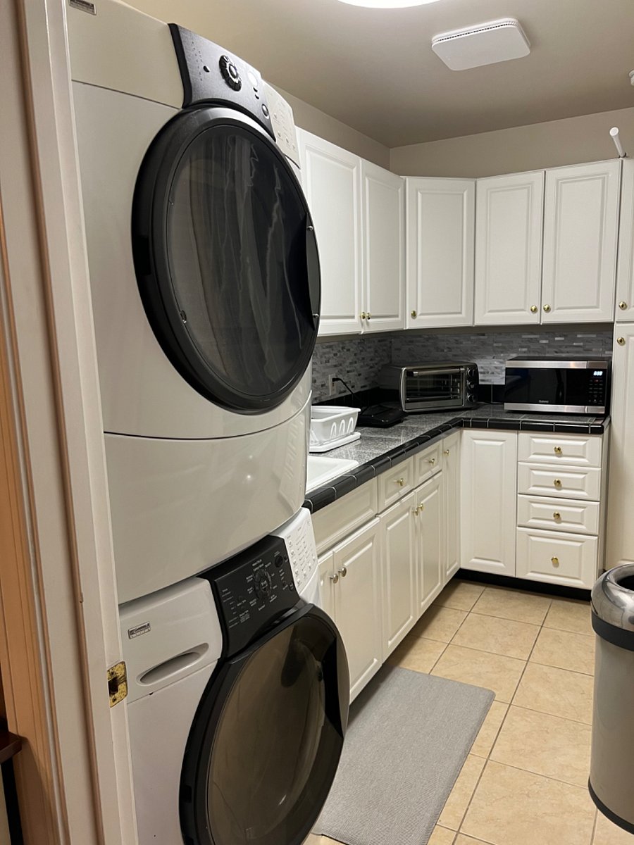 Washer/dryer in kitchenette with convection microwave, toaster oven, induction hot plate, coffee percolator, electric pressure cooker. 