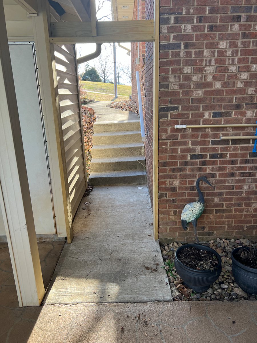 Steps from parking pad