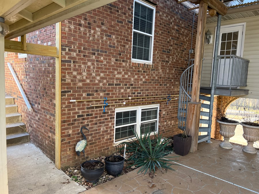 From parking pathway to private entrance up spiral staircase. 