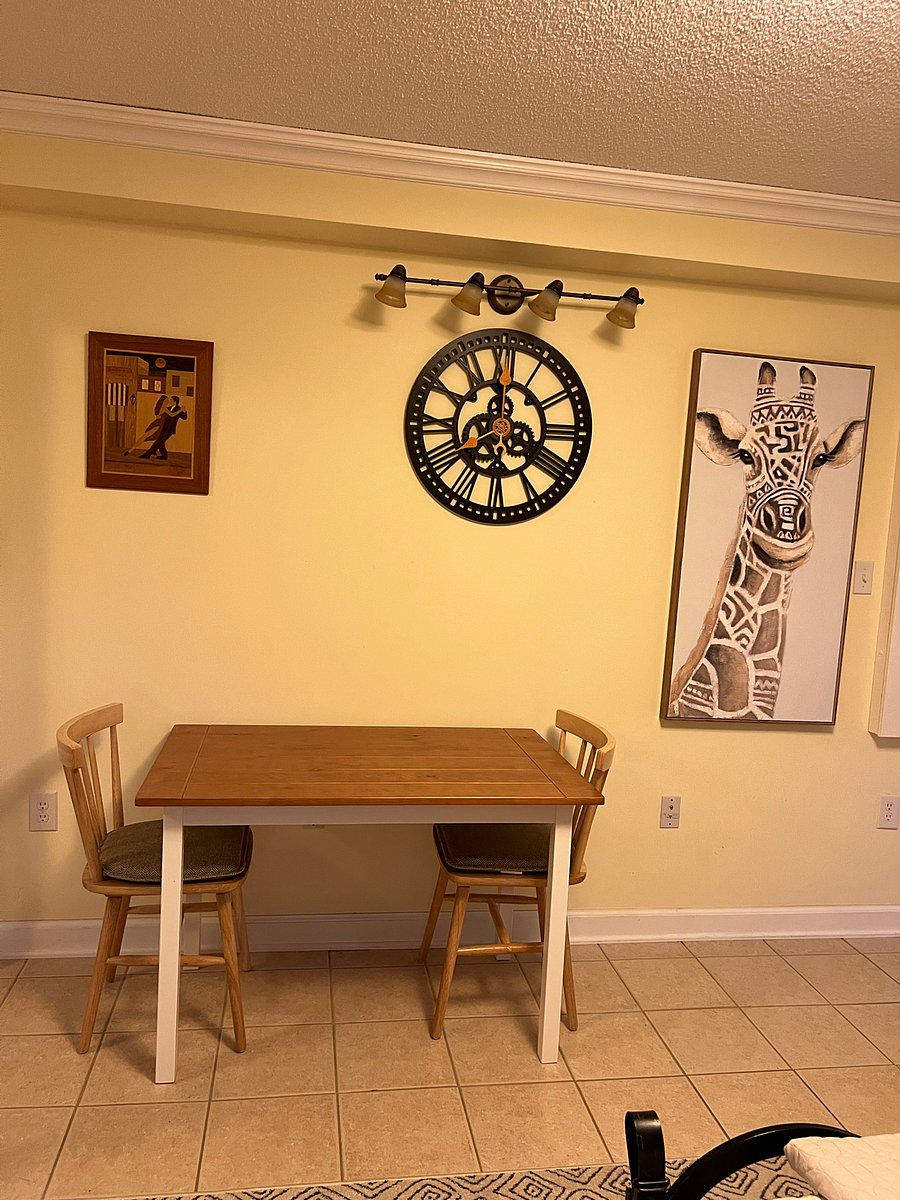 Table and chairs, Folding wall ironing board on the right