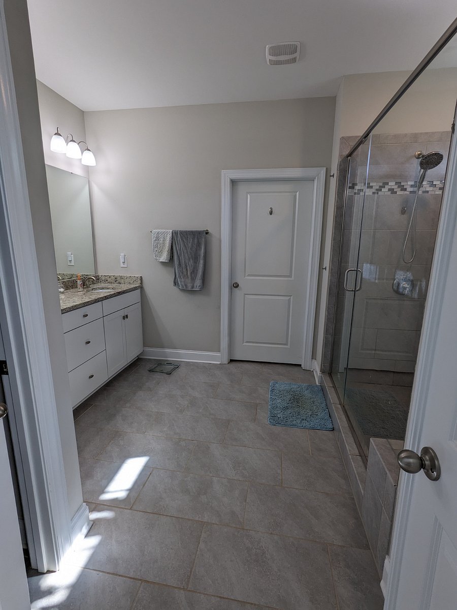 Master bathroom with linen closet.