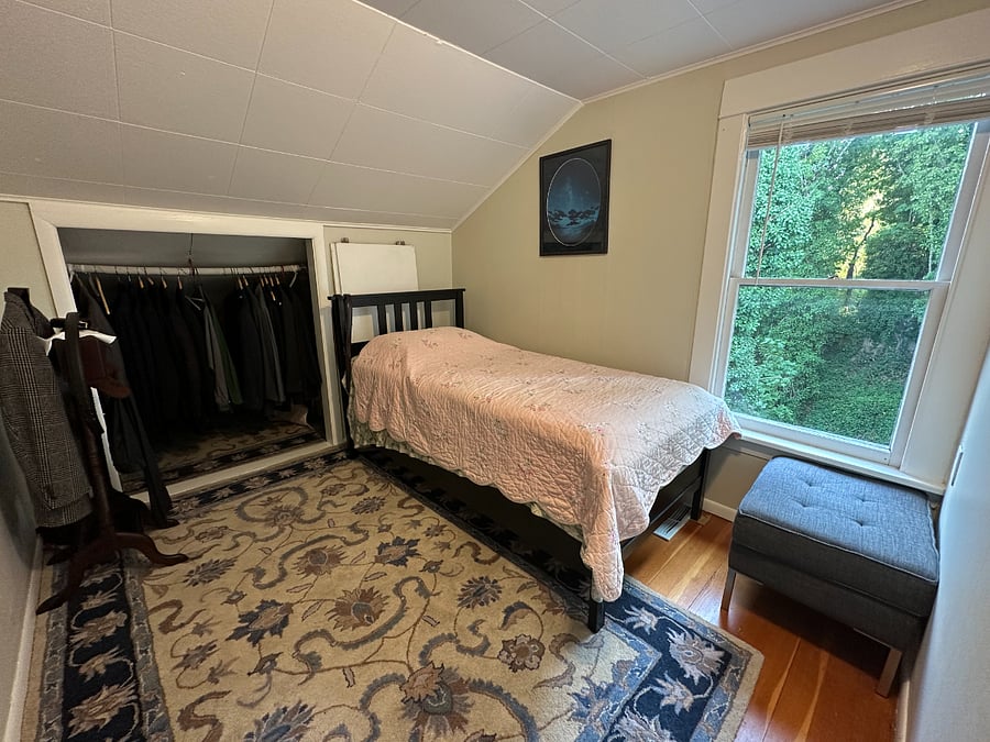 Smaller bedroom has a twin bed & large closet. Window view of the woods & stream. 