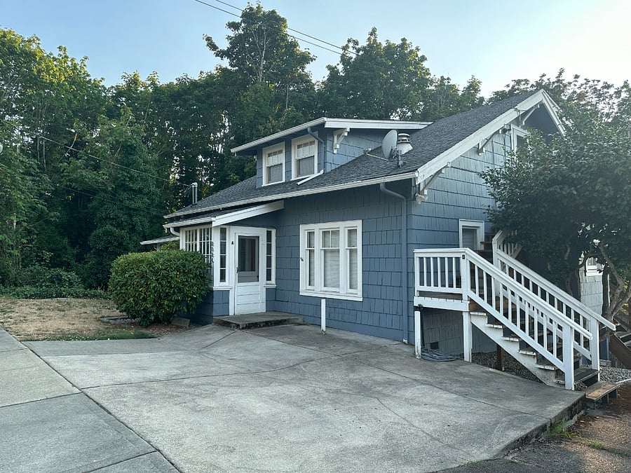 Entry is via stairway on the right. Assigned parking space is located just off camera to the right.
