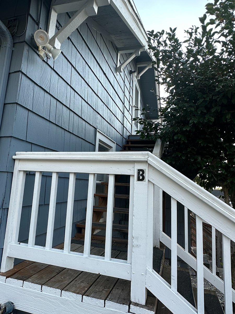 Unit B stairs go up to the entrance.
