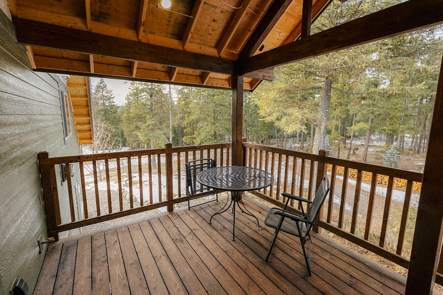 Spacious deck with garden, meadow, forested and long distance views.