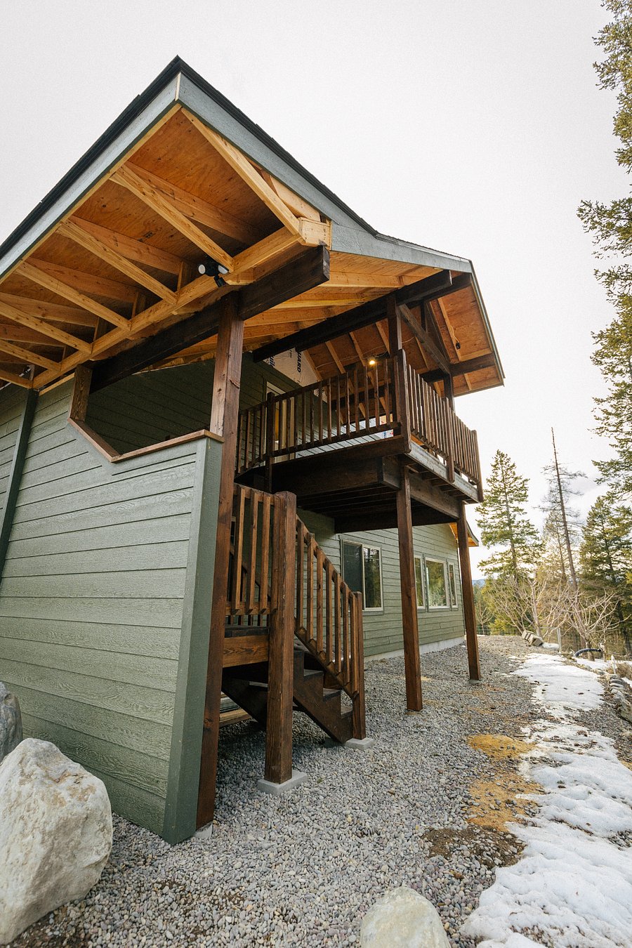 Private entry to covered deck adjacent to two dedicated parking spaces