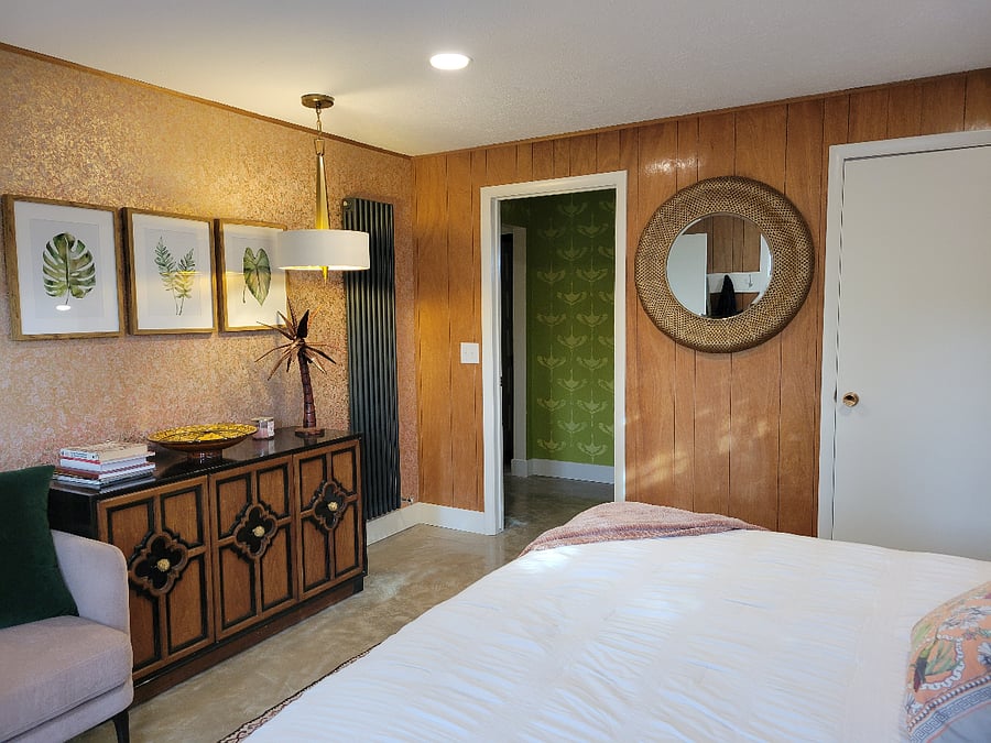 The bedroom has a large closet and a dresser.