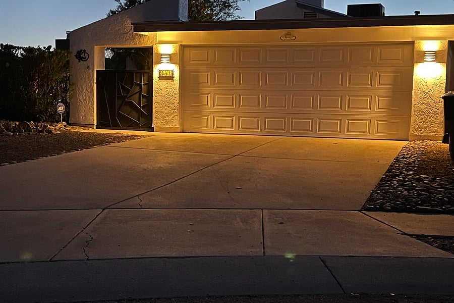 Front view of garage and gated entrance.