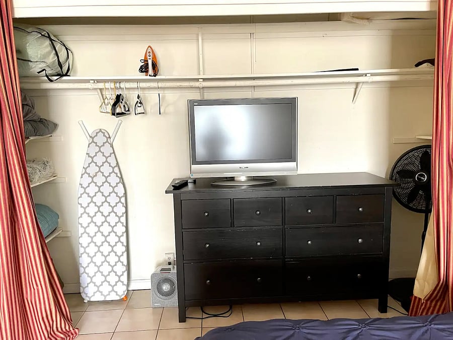 Large closet with shelves and dresser. Plenty of storage