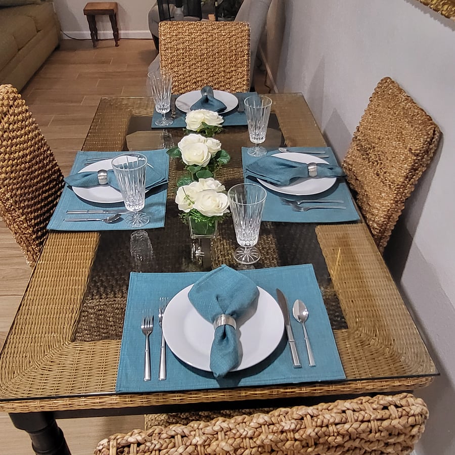 Table set for 4 but there are two extra chairs in the Reading room.