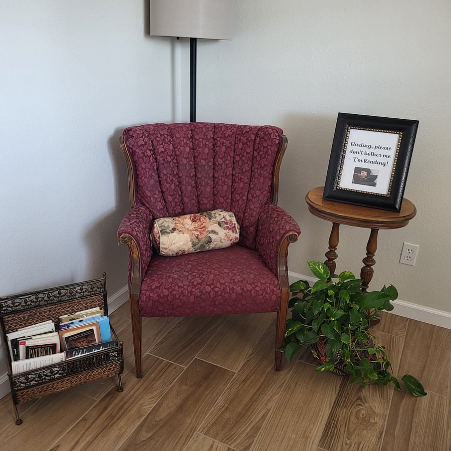 Reading corner in the third bedroom. Notice the framed sign!